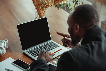 Image showing Businessman or student working from home while being isolated or keep quarantine \'cause of coronavirus COVID-19