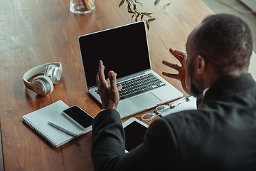 Image showing Businessman or student working from home while being isolated or keep quarantine \'cause of coronavirus COVID-19