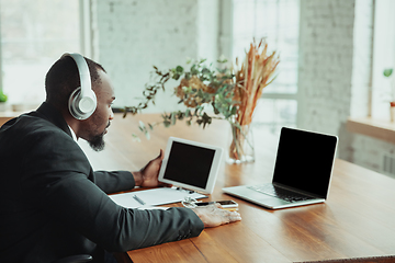 Image showing Businessman or student working from home while being isolated or keep quarantine \'cause of coronavirus COVID-19