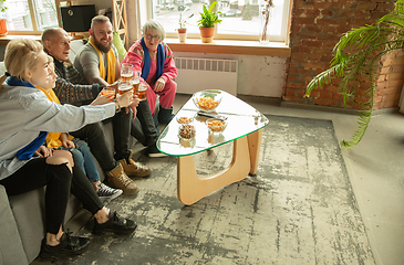 Image showing Excited family watching football, sport match at home