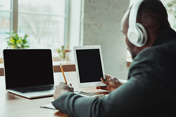 Image showing Businessman or student working from home while being isolated or keep quarantine \'cause of coronavirus COVID-19