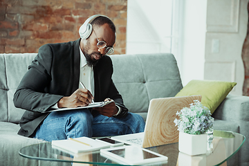 Image showing Businessman or student working from home while being isolated or keep quarantine \'cause of coronavirus COVID-19