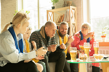 Image showing Excited family watching football, sport match at home