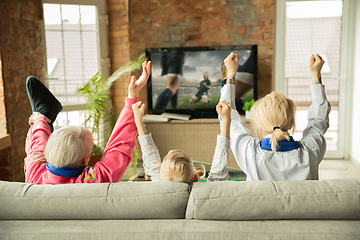 Image showing Excited family watching football, sport match at home, grandma, mother and son