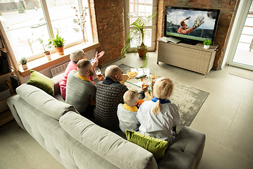 Image showing Excited family watching football, sport match at home