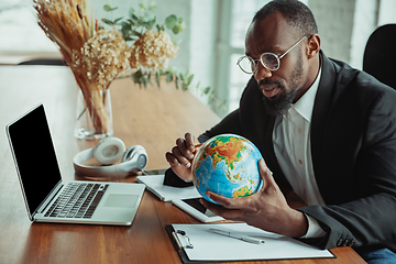 Image showing Businessman or student working from home while being isolated or keep quarantine \'cause of coronavirus COVID-19