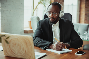 Image showing Businessman or student working from home while being isolated or keep quarantine \'cause of coronavirus COVID-19