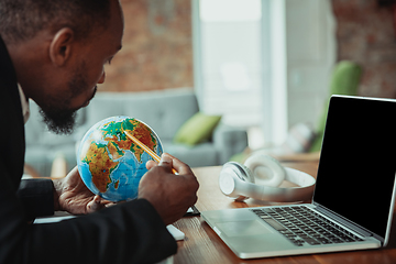 Image showing Businessman or student working from home while being isolated or keep quarantine \'cause of coronavirus COVID-19