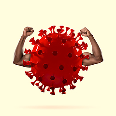 Image showing Model of COVID-19 coronavirus with strong male hands, concept of pandemic spreading