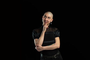 Image showing Monochrome portrait of young caucasian bald woman on black background