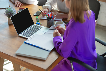 Image showing Business young caucasian woman in modern office with team