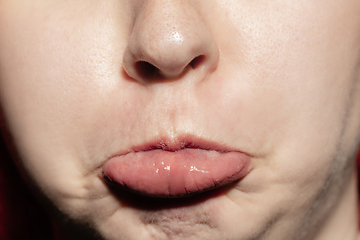 Image showing Close-up female mouth with natural lips make-up. Cosmetology, dentistry and beauty care, human emotions