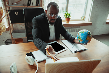 Image showing Businessman or student working from home while being isolated or keep quarantine \'cause of coronavirus COVID-19