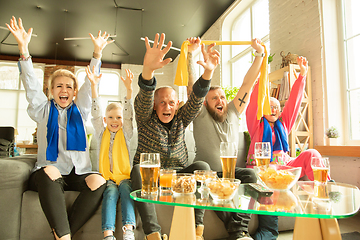 Image showing Excited family watching football, sport match at home