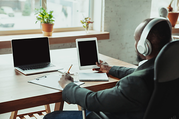 Image showing Businessman or student working from home while being isolated or keep quarantine \'cause of coronavirus COVID-19