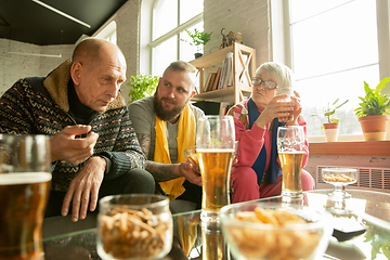 Image showing Excited family watching football, sport match at home