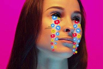 Image showing Tears illustrated of social media activity signs on female face in neon light. Real life versus online lifestyle, addiction to modern technologies