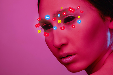 Image showing Tears illustrated of social media activity signs on female face in neon light. Real life versus online lifestyle, addiction to modern technologies