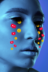 Image showing Tears illustrated of social media activity signs on female face in neon light. Real life versus online lifestyle, addiction to modern technologies