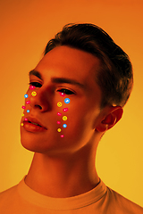 Image showing Tears illustrated of social media activity signs on male face in neon light. Real life versus online lifestyle, addiction to modern technologies