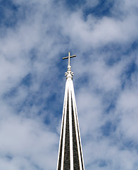 Image showing Christian cross atop of church steeple with clouds