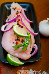 Image showing fresh organic chicken breast with herbs and spices