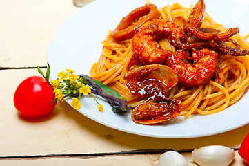 Image showing Italian seafood spaghetti pasta on red tomato sauce