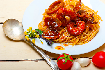 Image showing Italian seafood spaghetti pasta on red tomato sauce