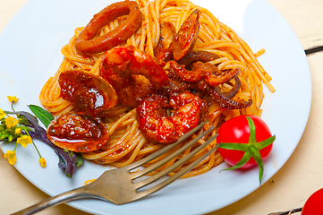 Image showing Italian seafood spaghetti pasta on red tomato sauce