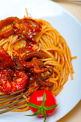 Image showing Italian seafood spaghetti pasta on red tomato sauce