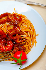 Image showing Italian seafood spaghetti pasta on red tomato sauce