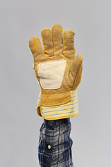 Image showing builder's hand in protective leather glove