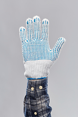 Image showing builder's hand in protective glove