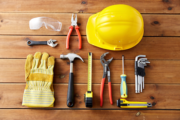 Image showing different work tools on wooden boards