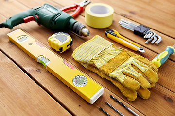 Image showing different work tools on wooden boards