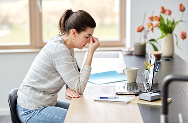 Image showing tired woman with laptop working at home office