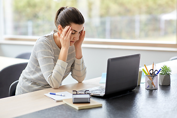 Image showing tired woman with laptop working at home office