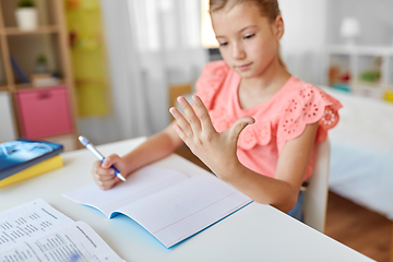 Image showing student girl with notebook counting fingers