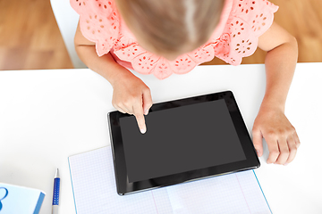 Image showing little student girl using tablet computer at home