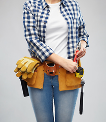 Image showing woman or builder with working tools on belt