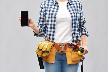 Image showing woman or builder with phone and working tools