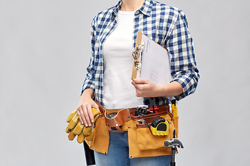 Image showing woman with clipboard, pencil and working tools