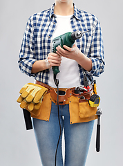 Image showing woman or builder with drill and work tools