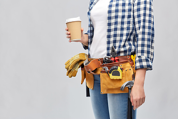 Image showing woman with takeaway coffee cup and working tools