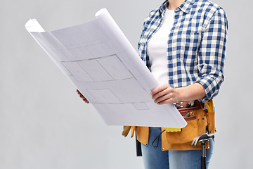 Image showing female builder with blueprint and working tools