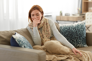 Image showing sick woman in scarf coughing at home