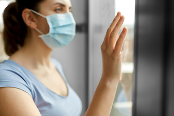 Image showing sick young woman wearing protective medical mask