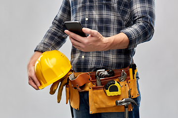 Image showing worker or builder with phone and working tools