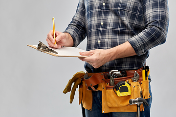 Image showing builder with clipboard, pencil and working tools