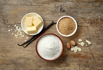 Image showing baking ingredients on wooden table